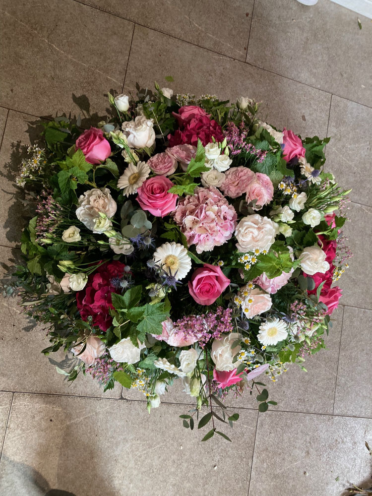 Coussin rond rose et blanc